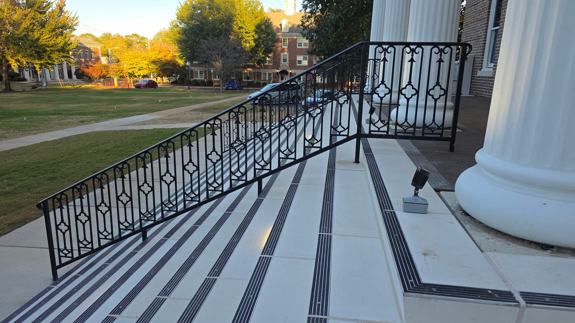 Decorative railing panels following the entrance steps at Brown Hall